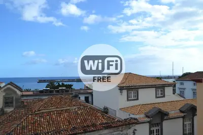 awwf sign on the side of a building with roofs at Central Studio in Funchal 3S in Funchal