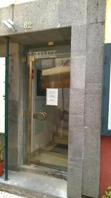 a glass door of a building with a sign on it at Central Studio in Funchal 3S in Funchal