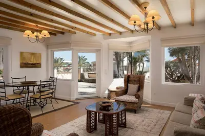 a living room with a table and chairs at Porto Moniz Villa in Porto Moniz