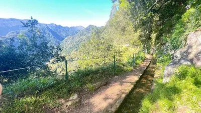 a view of a mountain valley with a fence at Porto Moniz Villa in Porto Moniz