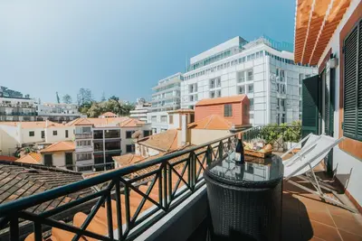 a balcony with a view of a city at Mansarda dos Aranhas by Madeira Best Apartments in Funchal