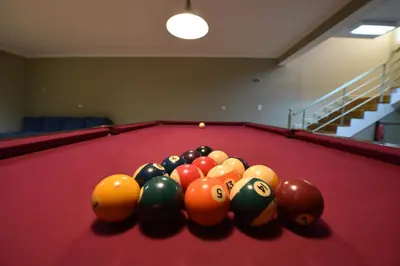 a group of billiard balls on a pool table at Villa Chaves in Funchal