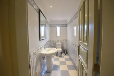 a bathroom with a sink and a toilet at Villa Chaves in Funchal