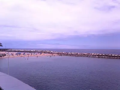 a beach with umbrellas and people on the beach at Charming Studio with Sea View - Ponta do Pargo - 20 m² in Ponta do Pargo