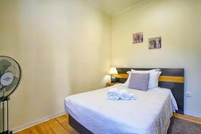 a bedroom with a bed with two towels on it at Vilamar- Madeira Inn Group in Calheta