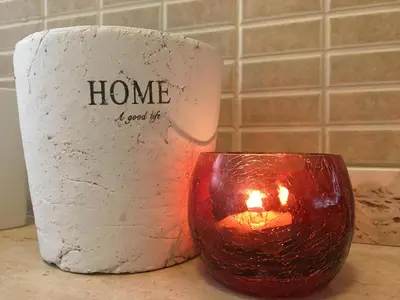 a roll of toilet paper and a candle on a counter at Atlantis Apartment in Câmara de Lobos