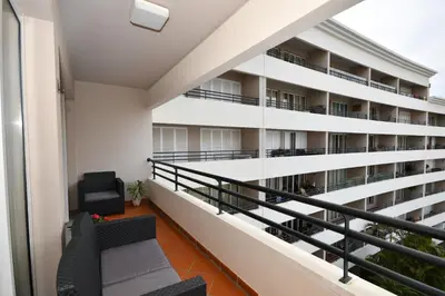 a balcony of an apartment building at M Palace II in Funchal