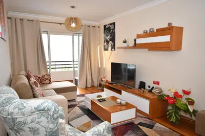a living room with a couch and a tv at M Palace II in Funchal