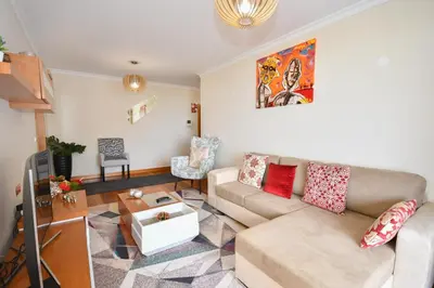 a living room with a couch and a table at M Palace II in Funchal