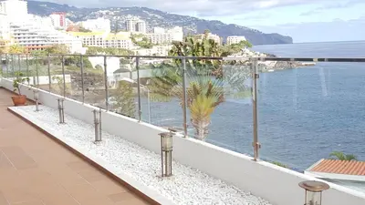a balcony with a view of the water at Apartamento Funchal com vista Mar in Funchal