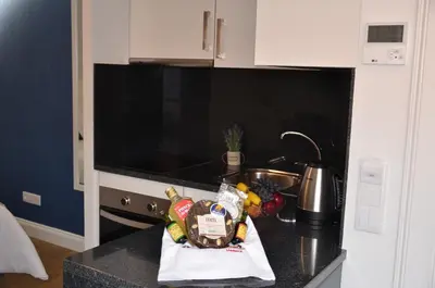 a kitchen counter with a sink and some food on it at Edificio Charles 303 in Funchal