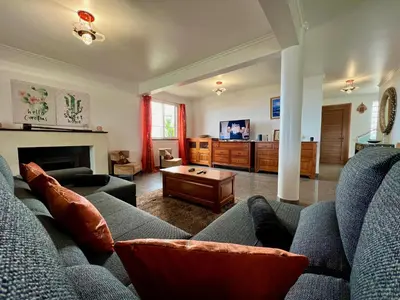 a living room with a couch and a table at Villa Passion by AnaLodges in Funchal