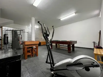 a room with a ping pong table and a ping pong racket at Villa Passion by AnaLodges in Funchal