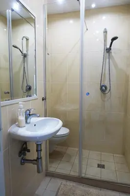 a bathroom with a sink and a shower at CASA MONACO vue mer in Luz