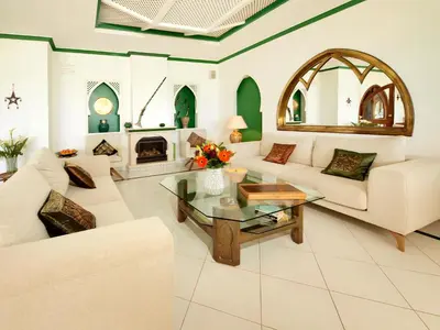 a dining room with a table and chairs at Villa Esmeralda in Lagos