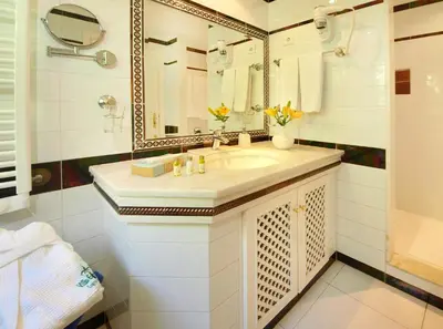 a bedroom with a large bed and a large window at Villa Esmeralda in Lagos
