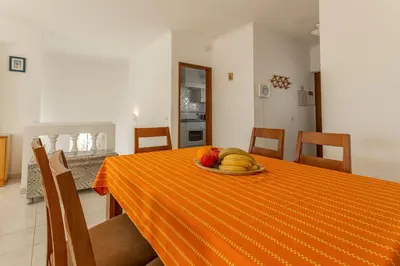 a bedroom with two bunk beds and a dresser at Casa Tulipa in Luz