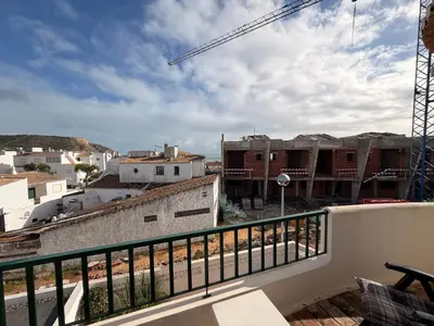 a view of the ocean from a hill with plants at Casa Tulipa in Luz