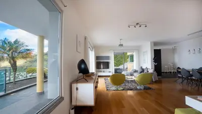 a living room with a view of a living room at Estrela do Mar - by LovelyStay - Lovely, Sun Filled Villa in Calheta