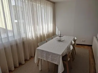 a dining room with a table and chairs and a window at Funchal Downtown Flats 2 in Funchal
