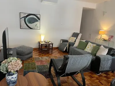 a living room with a couch and a table at Funchal Downtown Flats 2 in Funchal
