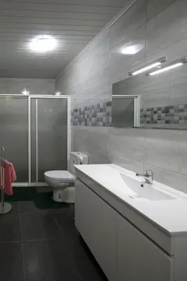a bathroom with a sink and a toilet and a shower at Lobos Rustic House II in Câmara de Lobos