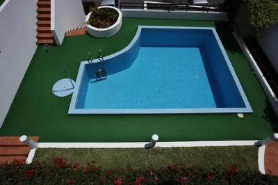 an overhead view of a swimming pool in a yard at Canico Bay Apartments in Caniço