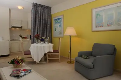 a living room with a couch and a table at Canico Bay Apartments in Caniço