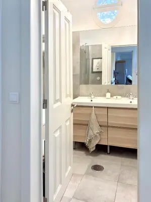 a bathroom with a sink and a mirror at Villa Wisteria in Funchal