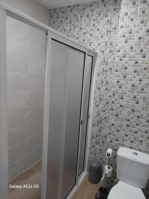 a bathroom with a shower with a toilet in it at A Slice of Paradise - Palheiro Golf in Funchal