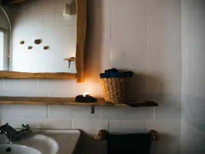 a bathroom with a sink and a mirror at Soul Farm Algarve - Glamping & Farm Houses in Aljezur