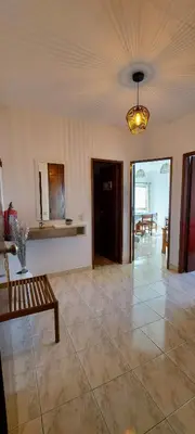 a living room with a couch and a table at Sunset View Flat in Aljezur