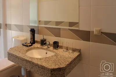 a bathroom with a sink in a room at Solar do Carvalho in São Vicente