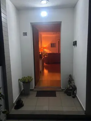 a hallway leading to a living room with a hallway at TRIPLEX TERRASSE VUE EXCLUSIVE SUR L OCÉAN ,WIFI in Santa Cruz