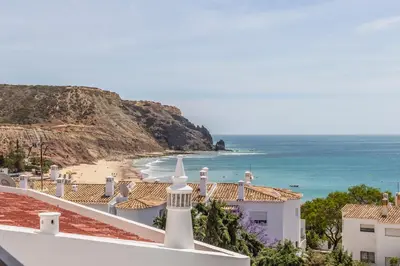 a view of a beach from the roof of a building at H&H seaview in Luz