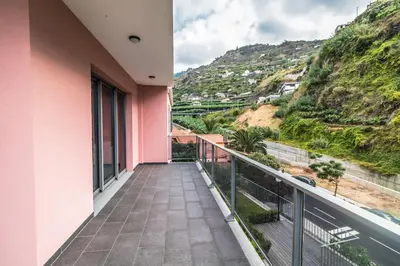 a balcony with a view of a mountain at Pink House - Tabua (Ribeira Brava) in Ribeira Brava