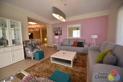 a living room with a couch and a table at Pink House - Tabua (Ribeira Brava) in Ribeira Brava