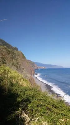 a view of the beach from a hill with the ocean at Casa Reis in Santana
