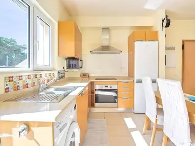 a kitchen with a sink and a refrigerator at Casa Aromas do Mar, Burgau in Burgau