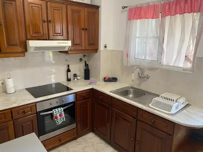 a kitchen with a sink and a stove at Santa Luzia Apartment in Funchal