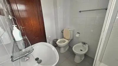 a bathroom with a toilet and a sink at Santa Luzia Apartment in Funchal
