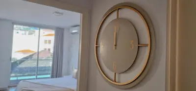 a mirror hanging on a wall in a bedroom at Upscales by LovelyStay - private parking in Funchal