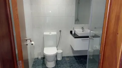 a bathroom with a toilet and a sink at Vivenda Cabral in Funchal