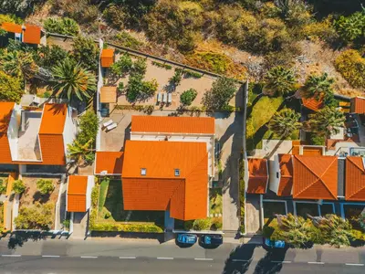 an overhead view of a house with orange roofs at Slowing Villas - Villa Oceano in Porto Santo