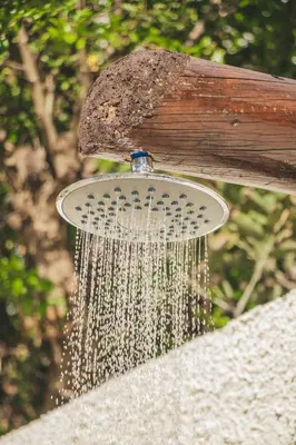 a bird bath with water pouring out of it at Slowing Villas - Villa Oceano in Porto Santo