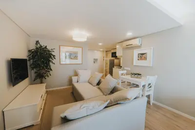 a living room with a couch and a table at Studio Marina by Madeira Best Apartments in Funchal