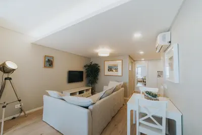a living room with a couch and a table at Studio Marina by Madeira Best Apartments in Funchal