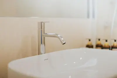 a white sink with a faucet in a bathroom at Studio Marina by Madeira Best Apartments in Funchal