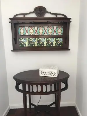a table with a stained glass window on a wall at Apart. Madeira 4 you in Funchal