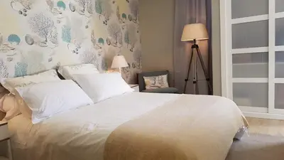 a white couch with pillows in a living room at SeaShell Romantic - Balcony with Ocean View & Pool in Funchal